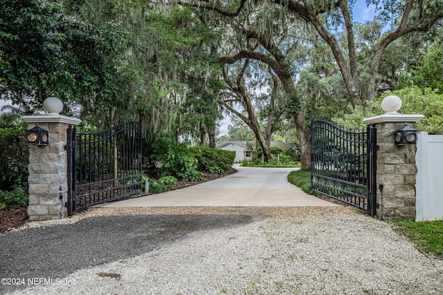 view of gate with fence