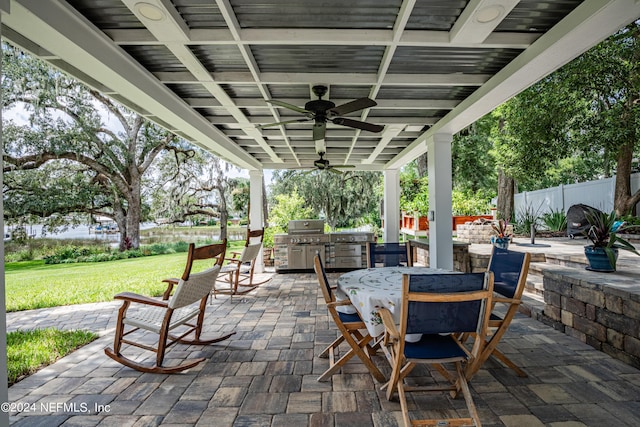 view of patio / terrace with fence, outdoor dining area, a ceiling fan, and area for grilling