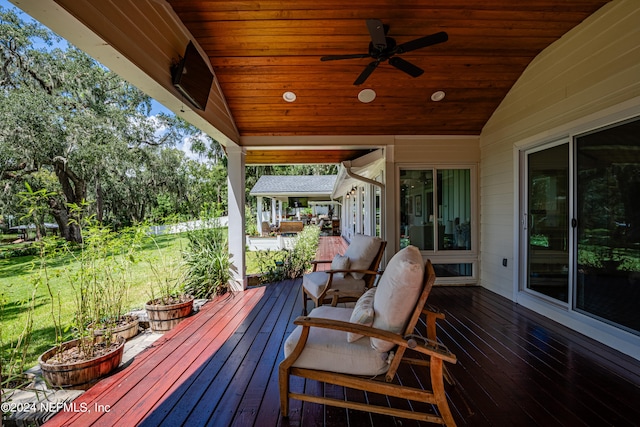 wooden terrace featuring ceiling fan