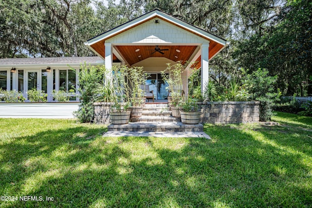 exterior space featuring a ceiling fan