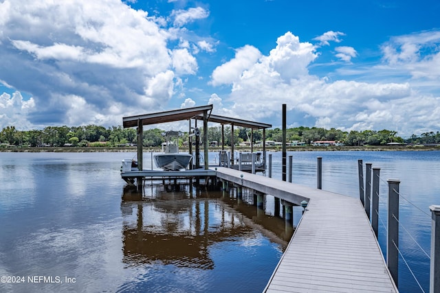 view of dock featuring a water view and boat lift