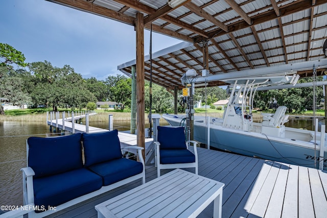 dock area with a water view and an outdoor hangout area