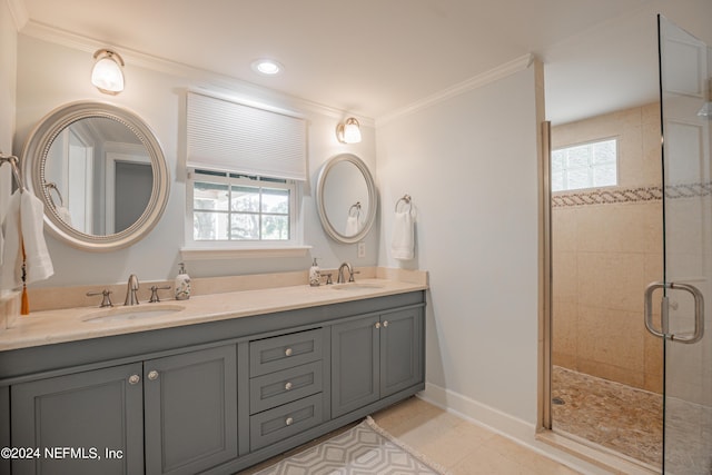 bathroom with crown molding, a tile shower, and a sink