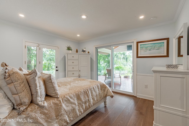 bedroom with dark wood-type flooring, multiple windows, and access to exterior