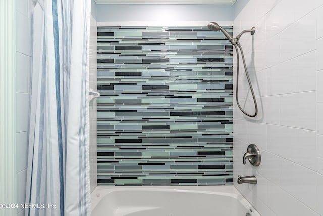 bathroom with shower / tub combo with curtain