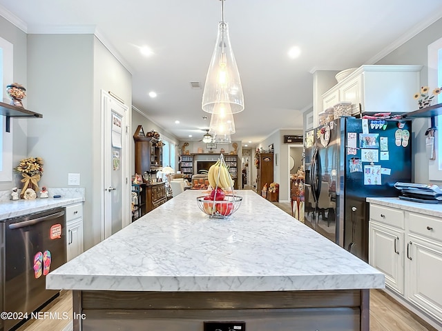 kitchen featuring white cabinets, crown molding, and light hardwood / wood-style floors