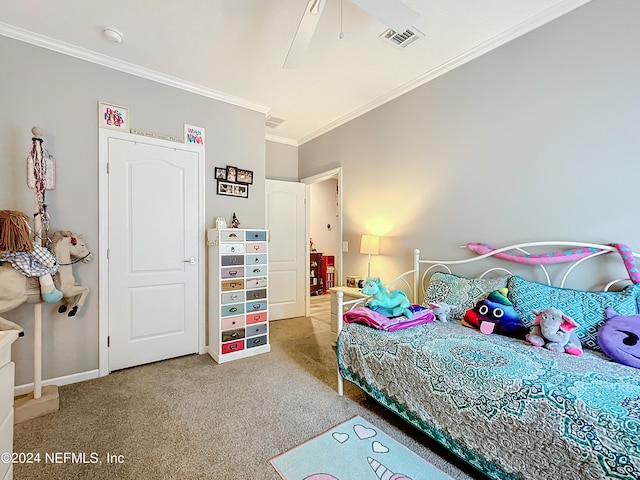 bedroom with ornamental molding, ceiling fan, and carpet floors