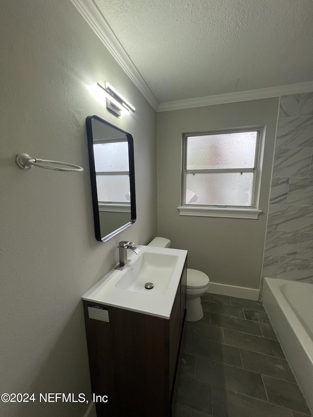 bathroom with crown molding, toilet, vanity, a textured ceiling, and a bath