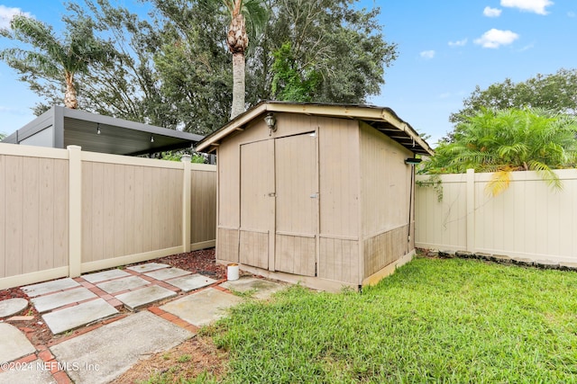 view of shed featuring a fenced backyard