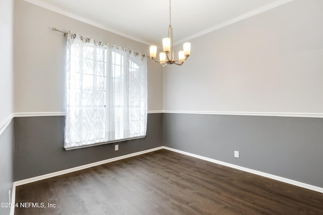 unfurnished room with baseboards, crown molding, wood finished floors, and a notable chandelier