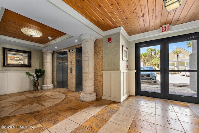 interior space featuring ornate columns, wooden ceiling, elevator, and light tile patterned floors