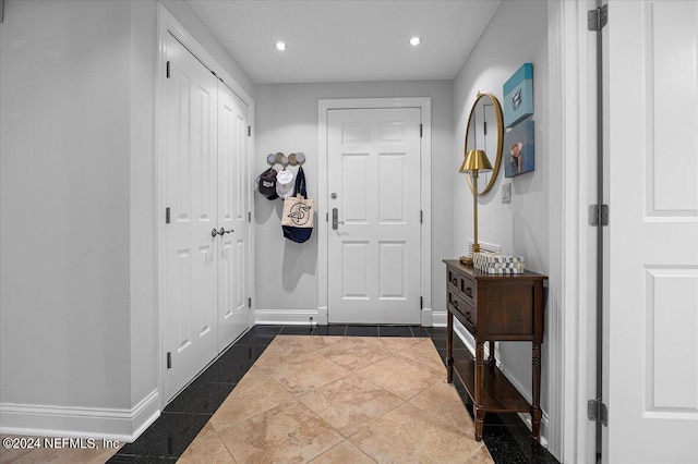 entrance foyer featuring tile patterned flooring