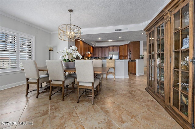 dining space with a notable chandelier, light tile patterned floors, and ornamental molding