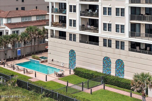 view of swimming pool with a patio area