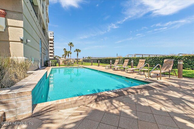 view of pool with a patio