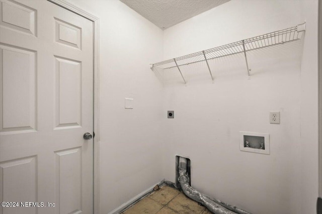 washroom featuring light tile patterned floors, electric dryer hookup, and hookup for a washing machine