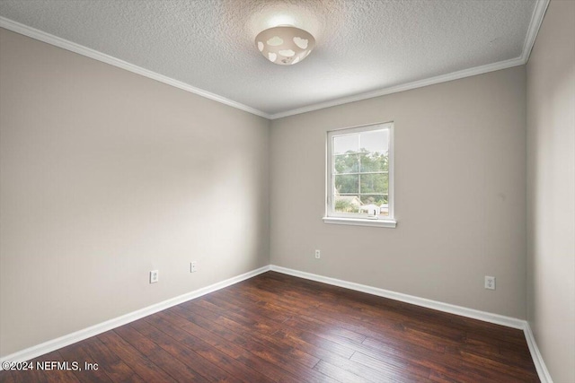 empty room featuring crown molding, dark wood-type flooring, and a textured ceiling