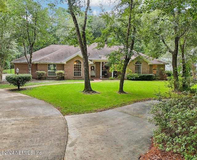 ranch-style house with a front yard