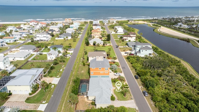 birds eye view of property with a water view and a residential view