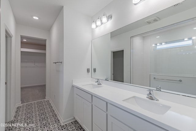 bathroom featuring tile patterned floors and vanity