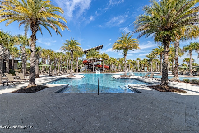 view of pool featuring pool water feature and a patio area