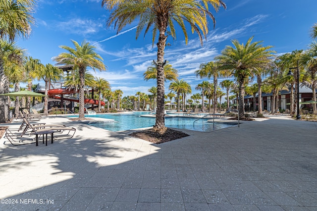 view of swimming pool with a patio