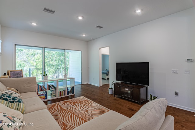 living room with dark hardwood / wood-style floors