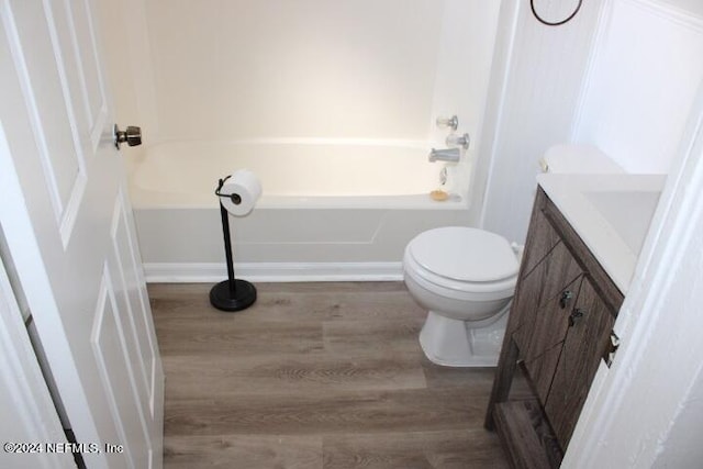 full bathroom with toilet, tub / shower combination, vanity, and wood-type flooring