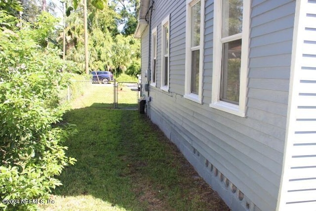 view of home's exterior featuring a yard