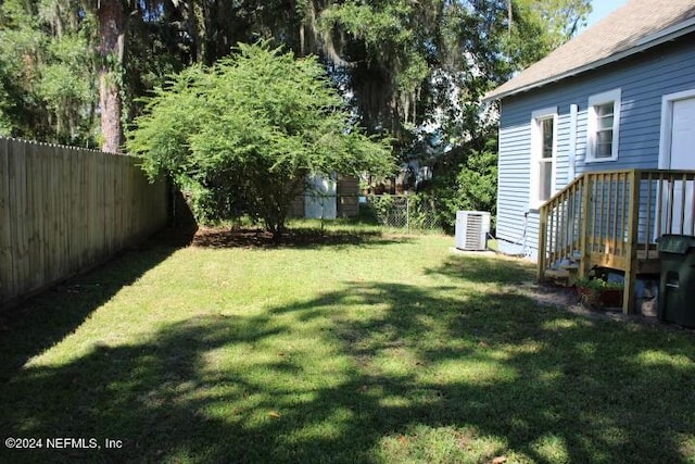 view of yard featuring central AC