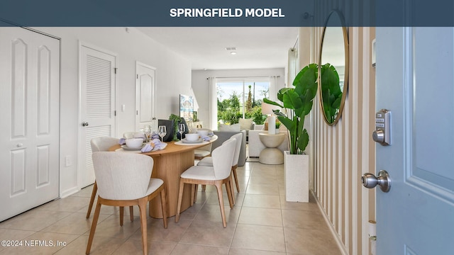 dining space with light tile patterned floors