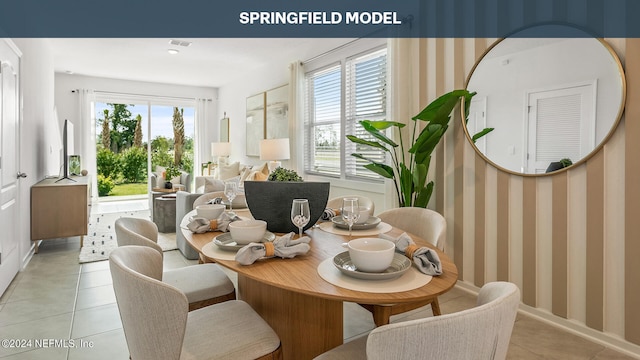 dining room featuring light tile patterned flooring and visible vents