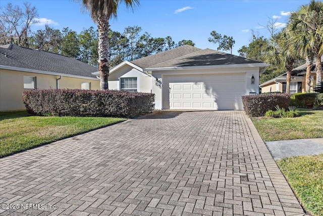 ranch-style house featuring a front lawn and a garage