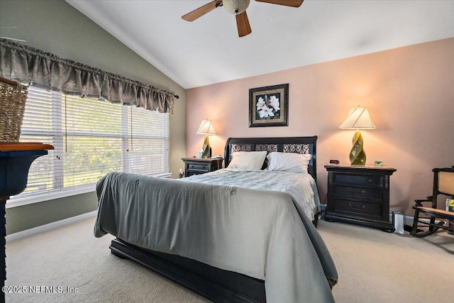 carpeted bedroom featuring vaulted ceiling and ceiling fan