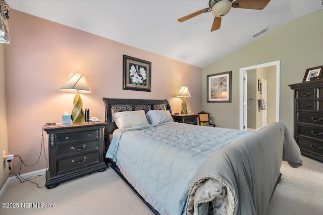 bedroom featuring light carpet, vaulted ceiling, and ceiling fan