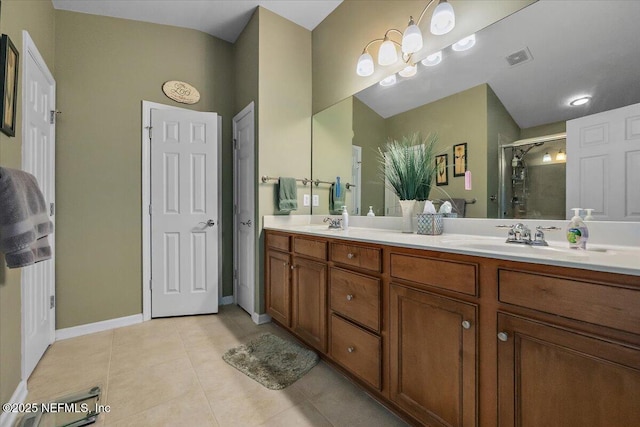 bathroom featuring tile patterned floors, vanity, an enclosed shower, and an inviting chandelier