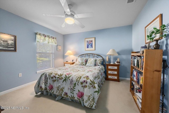 bedroom featuring light carpet and ceiling fan