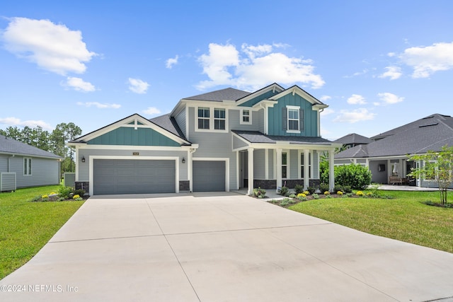 craftsman house featuring driveway, board and batten siding, a front yard, and cooling unit