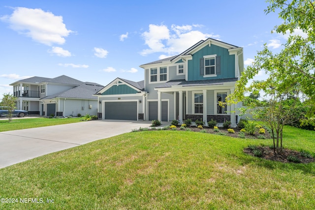 view of front facade featuring a porch, concrete driveway, an attached garage, board and batten siding, and a front lawn