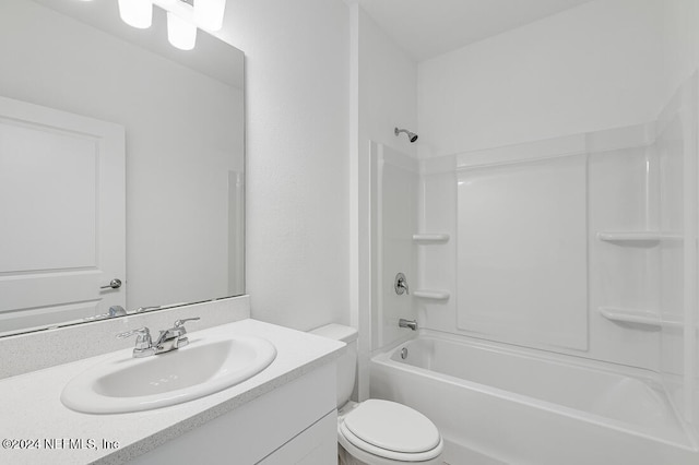 full bathroom with vanity,  shower combination, and toilet