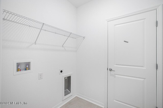 laundry area with hookup for an electric dryer and hookup for a washing machine