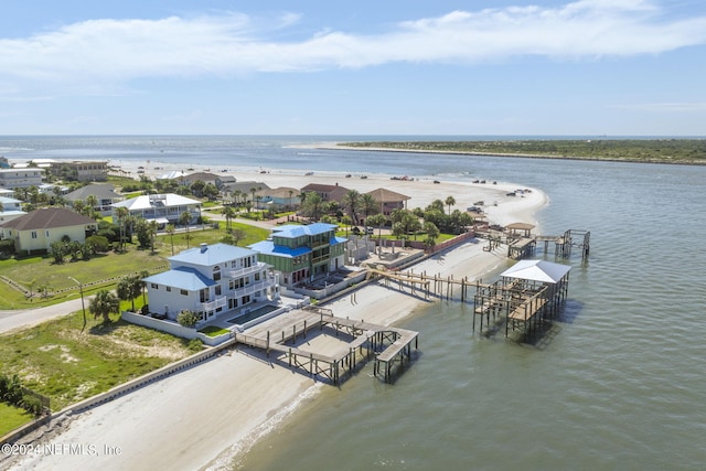 bird's eye view with a water view and a view of the beach