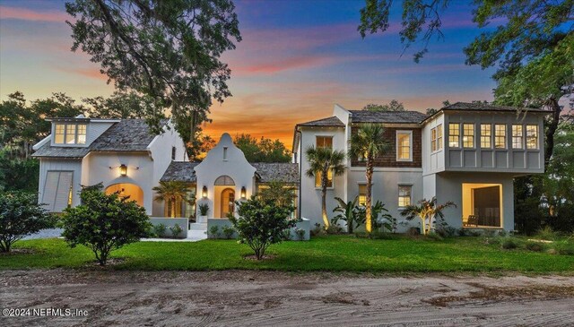 view of front of house with a yard