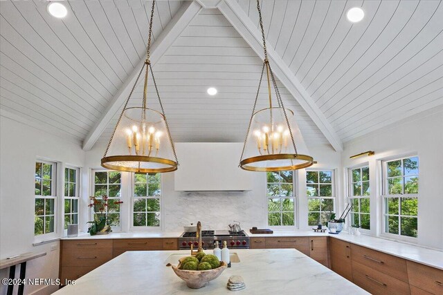 kitchen with decorative light fixtures, decorative backsplash, lofted ceiling with beams, high end stainless steel range oven, and wood ceiling