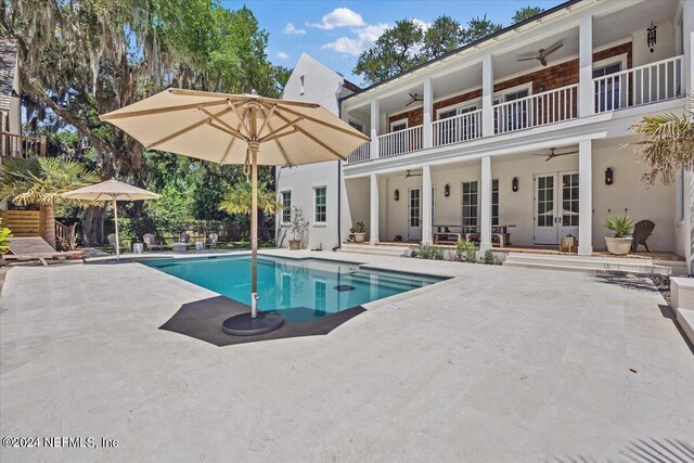 view of pool featuring ceiling fan, a patio area, and french doors