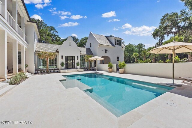 view of pool featuring a patio area