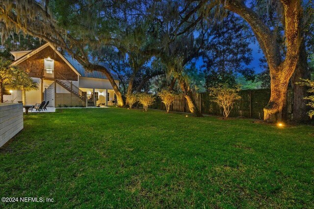 view of yard at night