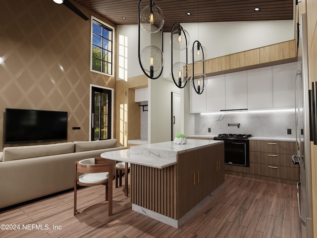 kitchen with hanging light fixtures, wood ceiling, high vaulted ceiling, a kitchen island, and wood-type flooring