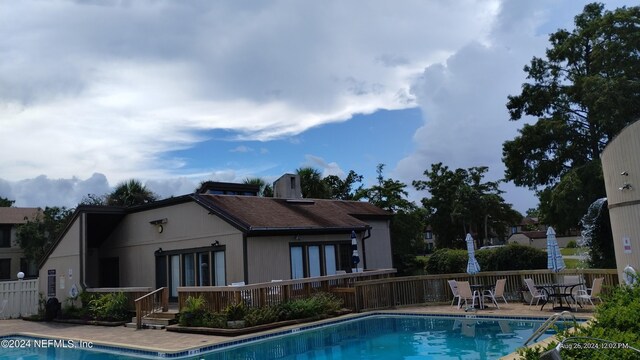 view of swimming pool featuring a patio area