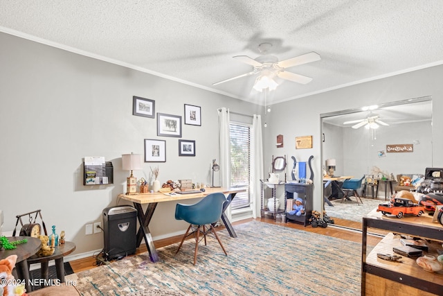 home office with ceiling fan, crown molding, and hardwood / wood-style flooring